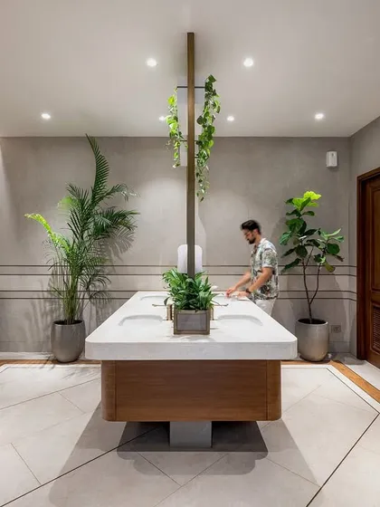 The men's section of the F-40A Farmhouse washroom block. A central island vanity with integrated planters and clean lines demonstrates our ability to bring a sense of luxury and design continuity to every part of an estate.