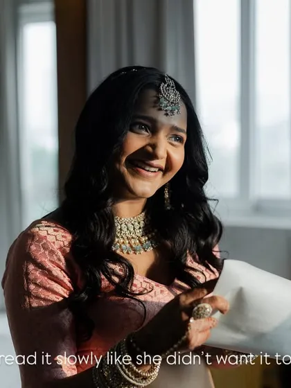 The pure joy on a bride's face as she reads a letter from her love. She read it slowly, as if she didn't want the moment to end, a beautiful, private smile just for him.