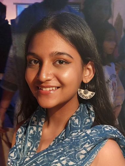 A smiling customer wearing a pair of my semi-circle patterned earrings at the Bhopal Potter's Market. These are lightweight and perfect for everyday wear.