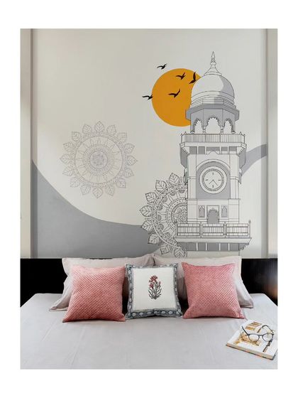 A custom wall mural depicting the local clock tower adds a personal and artistic touch to this bedroom in the '22'x110' House'.