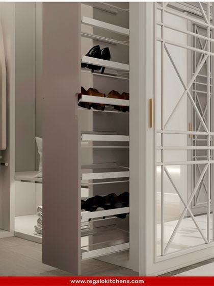 A slim, pull-out shoe cabinet that can be integrated beside a wardrobe. It's a discreet and efficient way to store shoes without taking up valuable closet space.