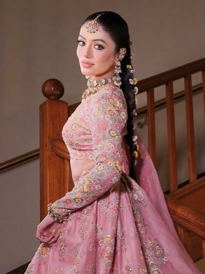 The side profile of this floral braid showcases its length and how it elegantly drapes over the shoulder.