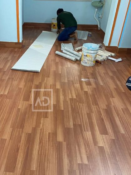 This photo shows my team during an installation. You can see the precision involved in laying each plank to ensure a seamless and professional result.