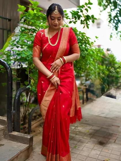 This is my look for the Ganesha festival. I am wearing a traditional red saree with a beautiful gold border, paired with a matching blouse that has delicate embroidery. This classic festive wear is perfect for any pooja or celebration.