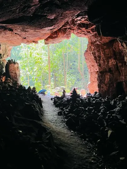 Exploring the ancient Ulavi Caves is a unique adventure. This view from inside one of the caves, looking out at the forest, shows the mystery and beauty of the place.