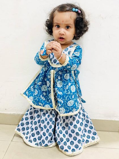 Another pose in her lovely Rakhi outfit. Finding the right traditional wear for kids that is also comfortable is always a win.