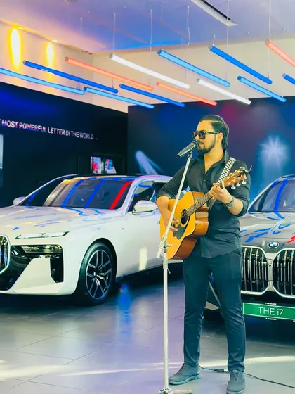 Here I am performing a solo acoustic set for a BMW car launch event. This clean, sophisticated setup is perfect for product launches and brand showcases, creating a cool and classy atmosphere for guests.