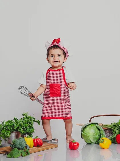 Is there a little chef in your house? We had so much fun with this adorable culinary-themed baby photoshoot, complete with a chef's hat, apron, and fresh veggies for props.