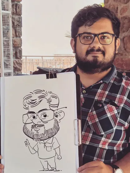 This gentleman is holding his full-body caricature, drawn live. I enjoy adding a bit of personality and pose to each drawing.