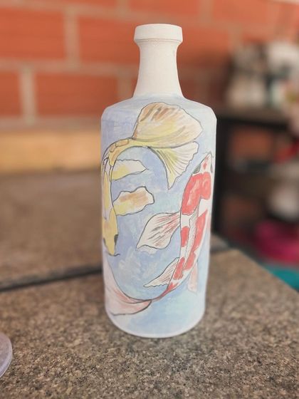 A different view of my hand-painted koi fish bottle. It makes a beautiful home decor piece.