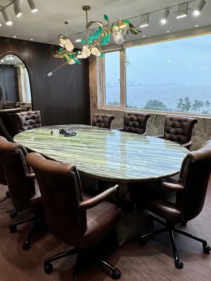 This conference room proves that a workspace can be both functional and inspiring. I chose a vintage, classy theme with rich leather chairs and a stunning green marble tabletop, all set against a breathtaking sea view. It’s a space designed for clear thinking and powerful decisions.