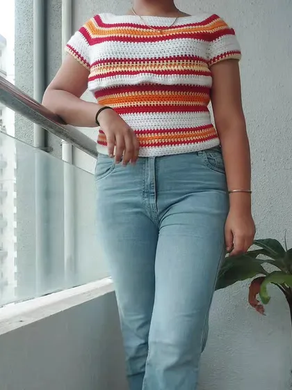 This is the Woolie Top, a classic striped tee with a boat neckline and short sleeves. It’s a versatile piece that’s perfect for everyday wear.