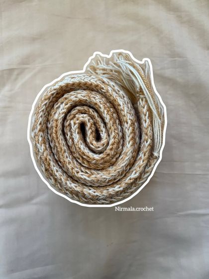 Our chunky muffler rolled up, showing the beautiful texture and thickness of the yarn. It’s as soft as it looks.