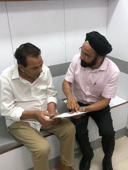 Here I am discussing a treatment plan with Dharmendra-ji. I believe in clear, honest conversations with every client to ensure they are comfortable and fully informed about their non-surgical options.