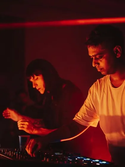 Two artists collaborating during the Mixmag Lab event. These special B2B sets are a highlight, offering a unique blend of styles and energy.