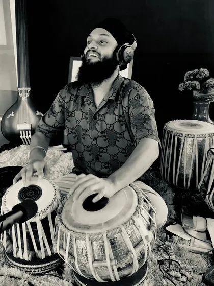 Lost in the rhythm. This black and white shot captures the feeling of being completely immersed in the music during a studio take.