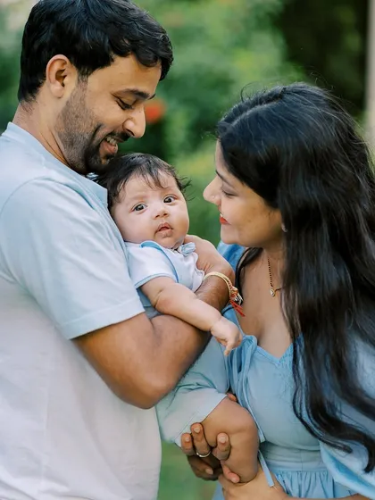 A lovely family portrait in coordinating blue outfits, showing how thoughtful wardrobe choices can enhance the beauty of the photos.