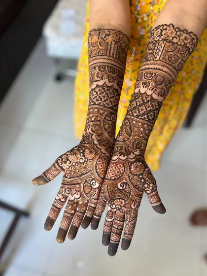 A beautiful mehendi design for the groom's mother. The patterns are intricate and elegant, perfect for celebrating the special day.