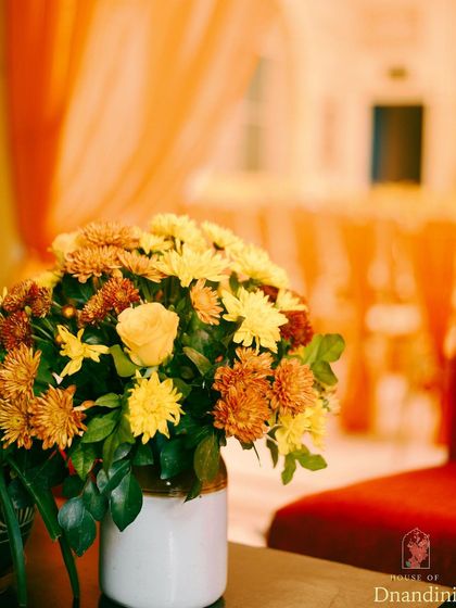 A before-and-after series showing the transformation of the chowk at Diggi Palace for a Haldi ceremony. The space was brought to life with an ombré of marigolds and vibrant fabrics.