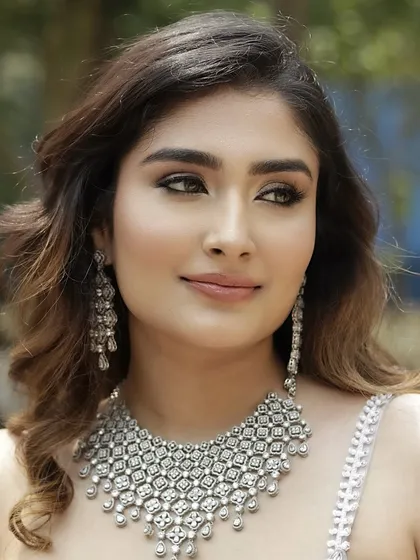 A detailed shot of the eye makeup and the stunning diamond necklace. The goal was to create a look that felt both sultry and sophisticated.