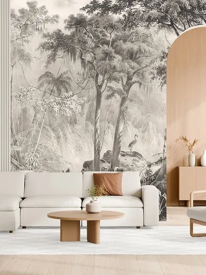 This large-scale monochrome jungle mural creates a stunning focal point in a minimalist living room. The detailed, artistic rendering adds a layer of sophistication and drama to the clean, modern decor.