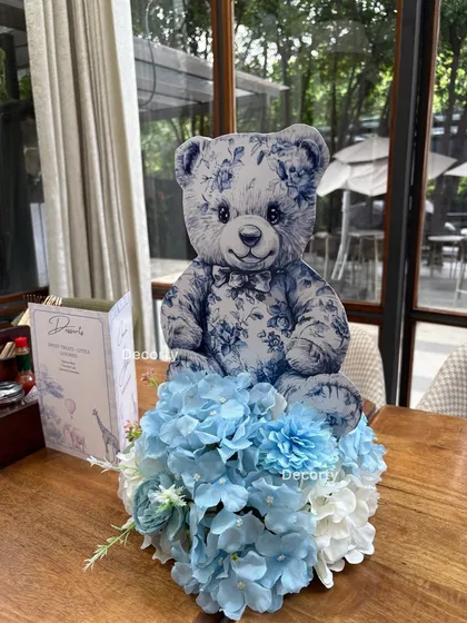 A matching table centerpiece in blue for the Dior-themed baby shower, showing how I coordinate colors for a cohesive look.