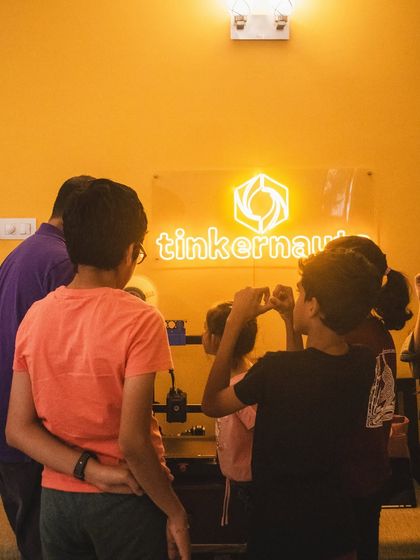 A group of young tinkerers gathers around our 3D printer, watching their digital designs become physical objects. This moment of seeing an idea come to life is what sparks a lifelong passion for creating.