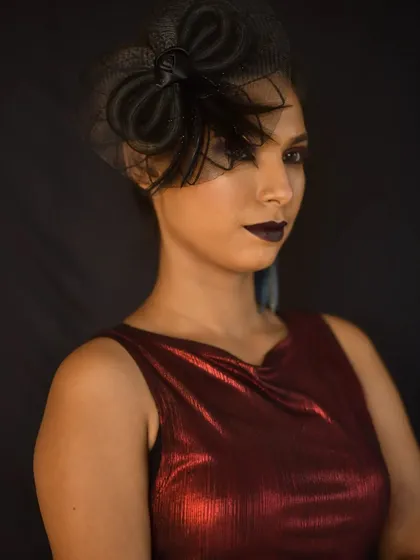 If you want something bold for a photoshoot or a party, I can create that too. This high-fashion look uses dramatic dark lips and a sharp, clean eye, perfect for making a statement.