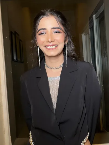 A chic and modern cocktail look for my bride Alisha. She paired a black blazer with a shimmery top, and I created a soft glam makeup look with sparkling silver eyes to match.