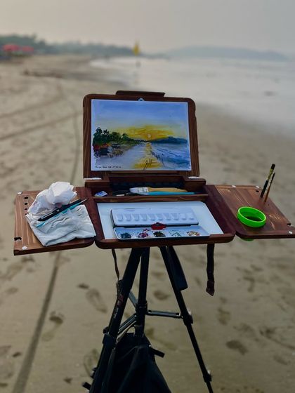 My plein air setup on the beach in Goa, with the finished watercolor painting of the sunrise. It was a perfect morning.
