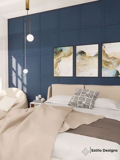 In this daughter's room, I used a deep blue accent wall with wooden molding to create a modern cottage feel. Sleek furniture and abstract paintings add a contemporary touch, while a large window allows for plenty of natural light.