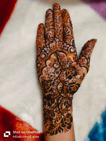 The final shot of this series, showcasing the beauty and detail of this single-hand henna design.