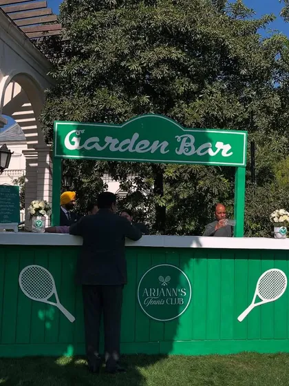 A fully branded "Garden Bar" for a tennis-themed corporate event. The clean design, custom logo, and thematic colors demonstrate how I create cohesive and professional branded environments from the ground up.
