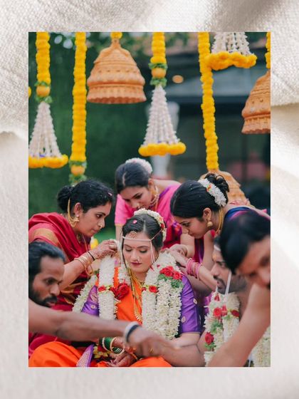 A duplicate of the bride being adorned by her family.