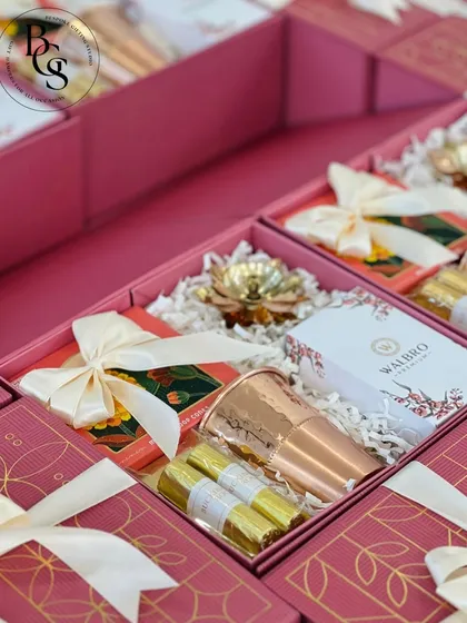 A look inside one of my custom corporate gift boxes. This hamper includes a hammered copper tumbler, gourmet chocolates, and other premium items, all elegantly arranged to impress a valued client or employee.