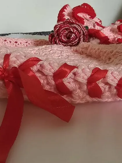 A close-up of the side lacing and the delicate rose embellishment on the Avery Top.
