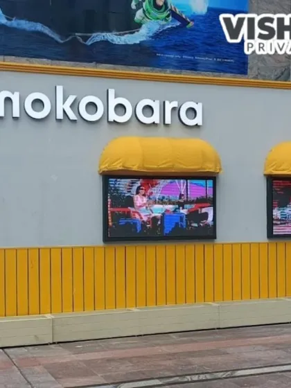 A close-up of the Mokobara store's exterior wall, showing the integration of digital display screens. This feature allows the brand to run dynamic video ads, making the pop-up even more engaging for passersby.