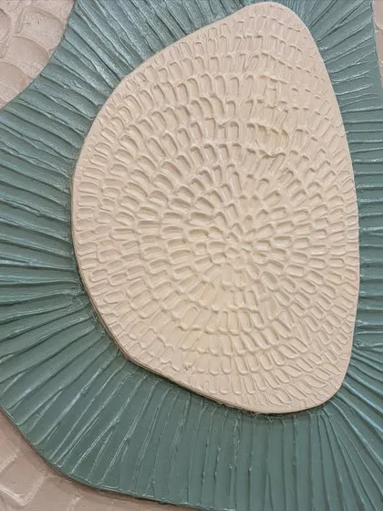 A close-up of the intricate textures on the layered board art. I use tools to carve and shape the textural paste, creating patterns that are both visually and tactilely interesting.