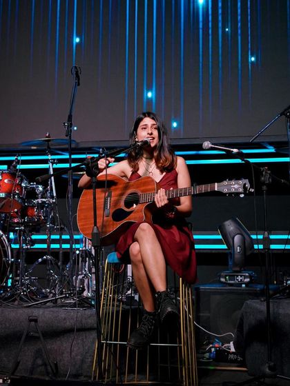 A happy moment on stage with my band. Performing with them is always a blast.