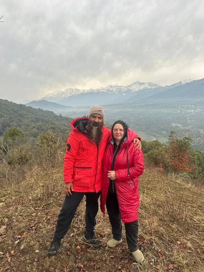 A photo with a student, both of us bundled up against the mountain chill. The shared experience of practicing in different climates and conditions builds resilience and camaraderie.