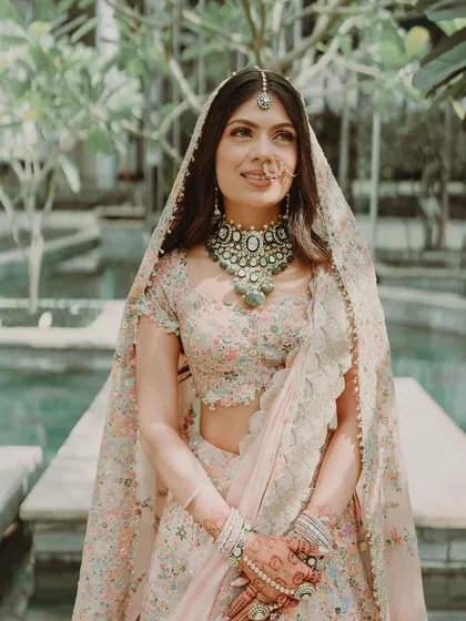 A beautiful portrait of Tanisha for her phera ceremony. Her makeup is soft and subtle, with a gentle focus on the eyes and a natural lip color, letting her stunning Anamika Khanna outfit shine.
