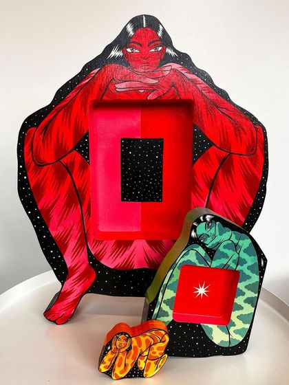 The three nesting figures of the 'Safe Spaces' sculpture shown separately, revealing the protective outer self, the introspective middle self, and the carefree inner self.