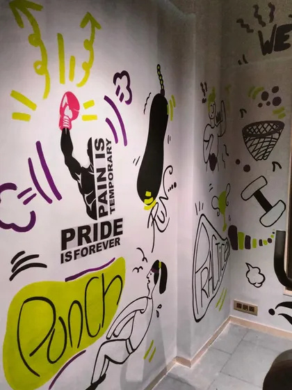 "Pain is temporary, pride is forever." I created this high-energy doodle mural for a gym in Bandra to keep the motivation buzzing. My art for fitness spaces mixes bold words and fun icons to give you that extra push.