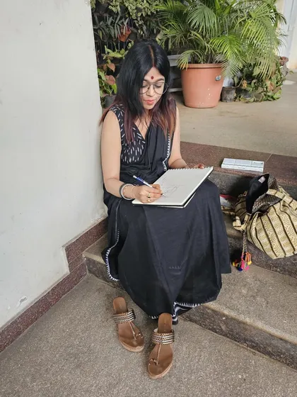 Doing what I love most, sketching. This candid shot was taken by a dear friend during a live sketching session at one of our exhibitions.