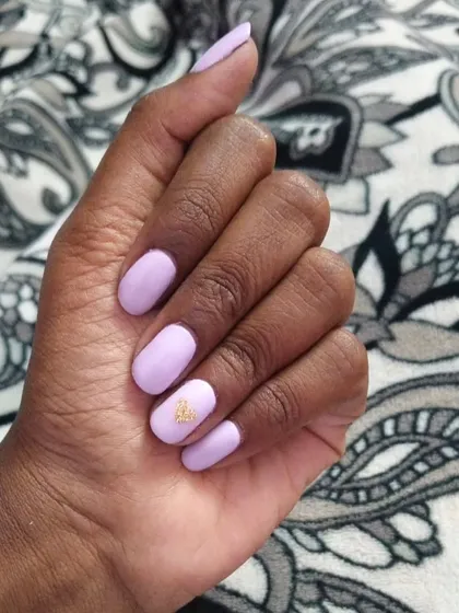 A lovely solid lavender gel polish on short, natural nails. I added a tiny gold butterfly decal on the ring finger for a subtle and cute accent.