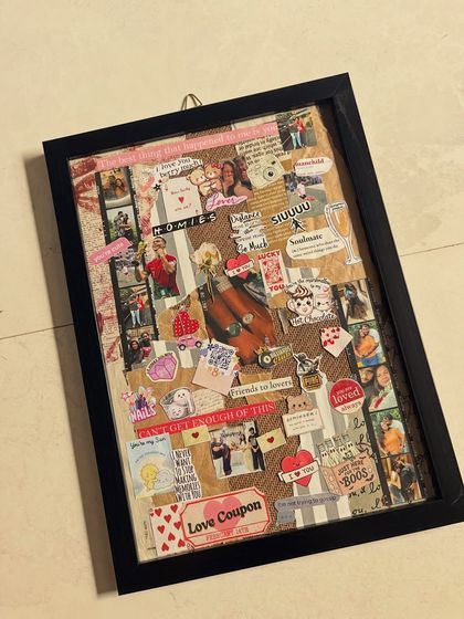 An angled view of a custom story frame, showing the depth and texture of the collage. This piece is filled with photos, notes, and stickers that represent a couple's journey, perfect for celebrating an anniversary or special milestone.