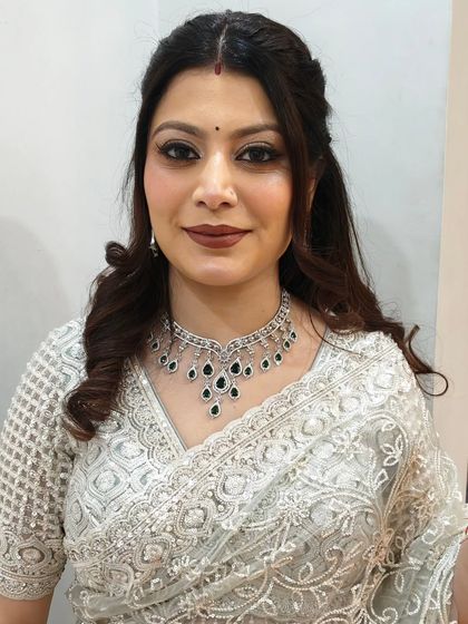 A straight-on shot of the subtle glam makeup. The winged liner defines the eyes, while the glitter adds a festive touch.