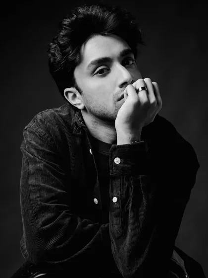 I love the texture of corduroy. This moody black and white shot of Lakshya in a corduroy shirt shows how fabric can add depth and character to a simple portrait.