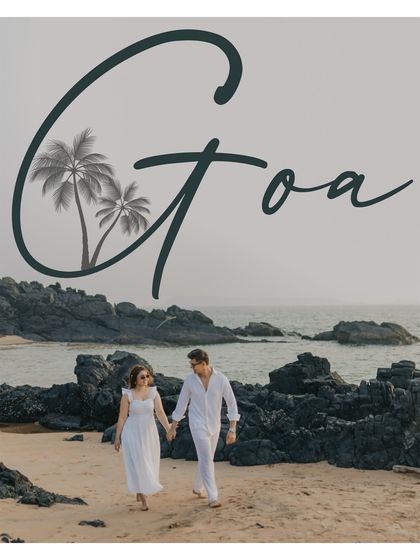A postcard-style shot of the couple walking hand-in-hand on a rocky Goan beach. This image evokes a sense of travel, adventure, and romance.