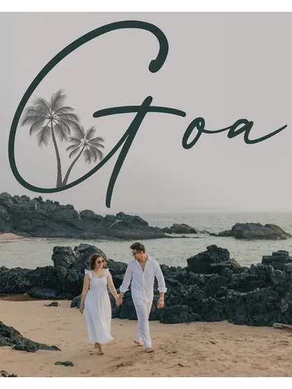 A postcard-style shot of the couple walking hand-in-hand on a rocky Goan beach. This image evokes a sense of travel, adventure, and romance.